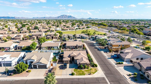 aerial view of residential area featuring a mountainous background