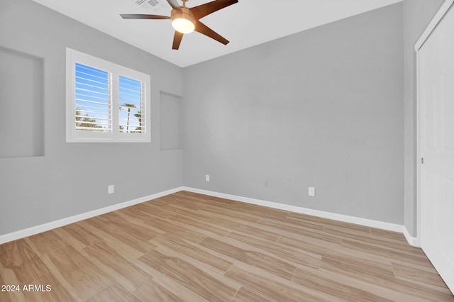 unfurnished room featuring ceiling fan and light hardwood / wood-style floors