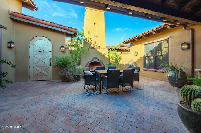 view of patio featuring exterior fireplace