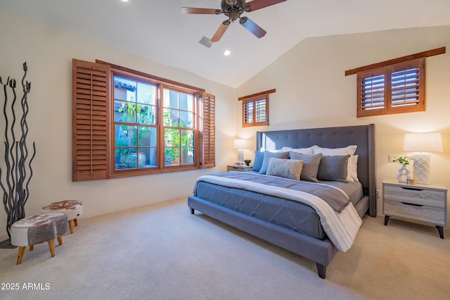 carpeted bedroom with ceiling fan and lofted ceiling