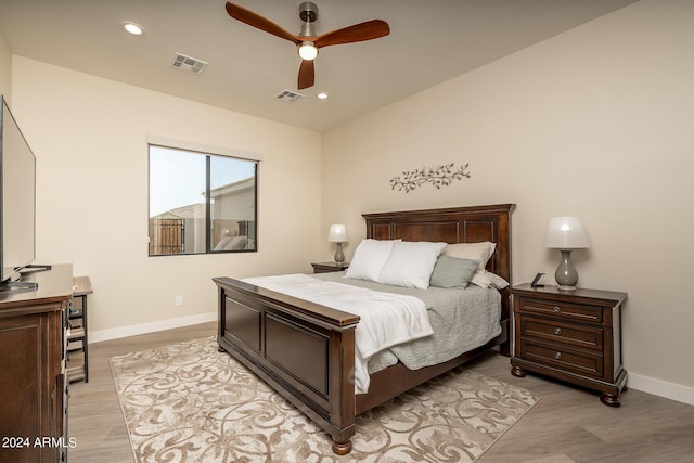 bedroom featuring ceiling fan and light hardwood / wood-style flooring