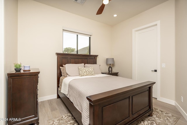 bedroom with light wood-type flooring and ceiling fan