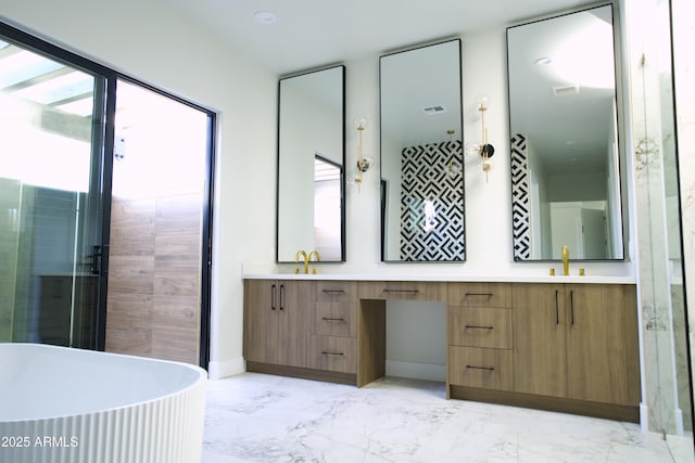 bathroom featuring vanity and a tub