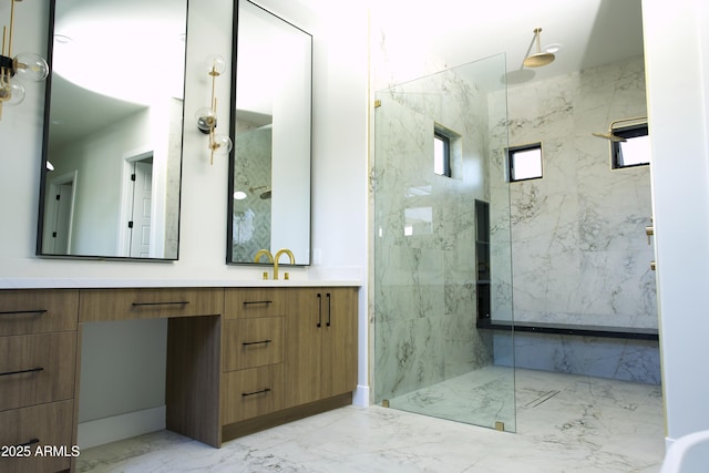 bathroom featuring vanity and an enclosed shower