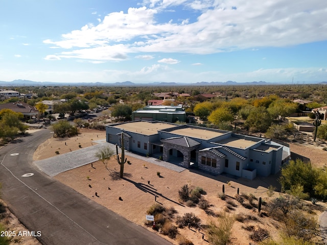 birds eye view of property with a mountain view