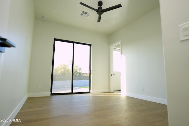 empty room featuring ceiling fan and light wood-type flooring