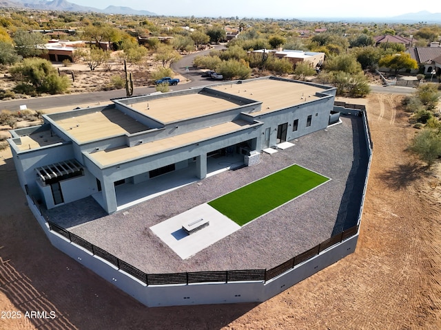 birds eye view of property with a mountain view