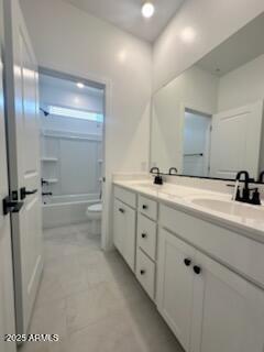 25336 W Bowker St, Buckeye, AZ 85326 - full bath featuring a sink, toilet, double vanity, and shower / bathing tub combination
