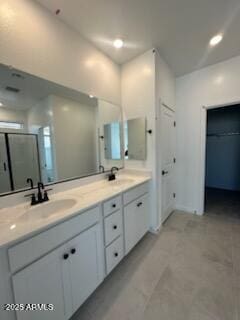 25336 W Bowker St, Buckeye, AZ 85326 - full bath featuring double vanity, a sink, and a stall shower