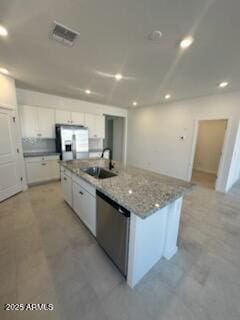 25336 W Bowker St, Buckeye, AZ 85326 - kitchen with white cabinetry, recessed lighting, a sink, stainless steel appliances, and a center island with sink