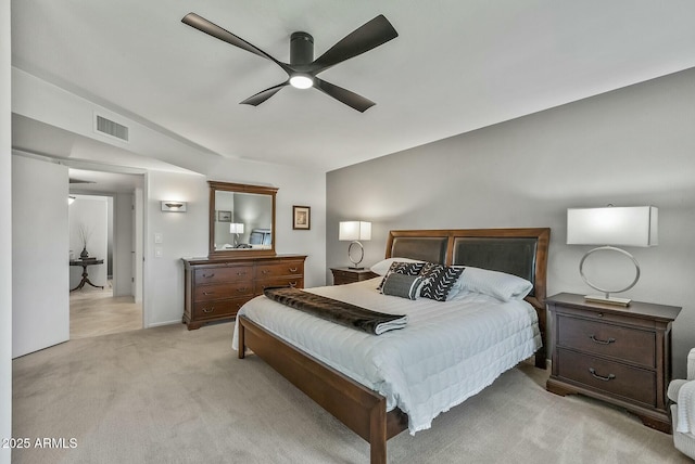 bedroom featuring visible vents, light colored carpet, and ceiling fan