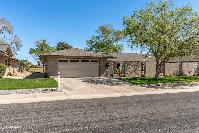 view of front facade featuring a front yard, fence, an attached garage, concrete driveway, and brick siding