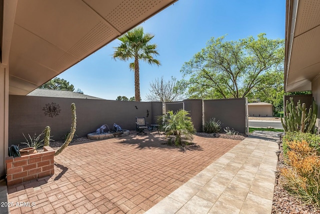 view of patio featuring fence