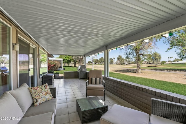 view of patio with grilling area and an outdoor hangout area