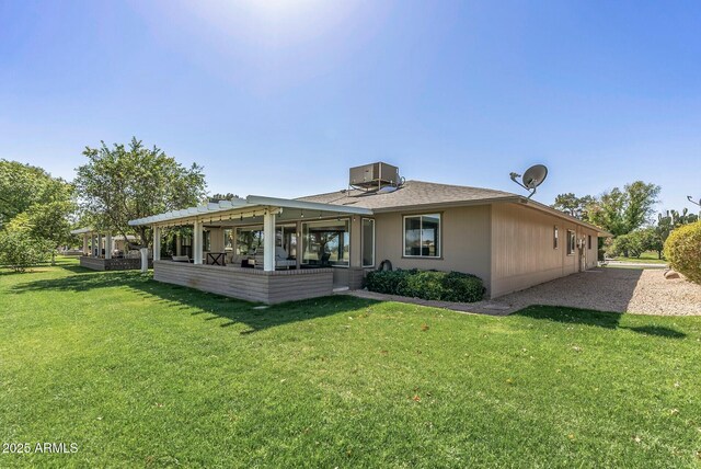 back of house featuring a patio area, central AC unit, a pergola, and a yard