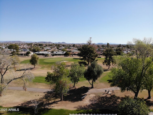 aerial view with view of golf course and a mountain view