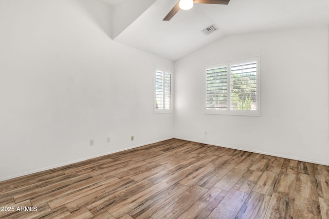 3044 E Sparrow Pl, Chandler, AZ 85286 - unfurnished room featuring a ceiling fan, visible vents, vaulted ceiling, wood finished floors, and baseboards