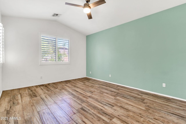3044 E Sparrow Pl, Chandler, AZ 85286 - unfurnished room featuring ceiling fan, visible vents, vaulted ceiling, wood finished floors, and baseboards