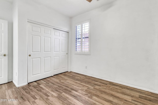 3044 E Sparrow Pl, Chandler, AZ 85286 - unfurnished bedroom featuring baseboards, wood finished floors, and a closet