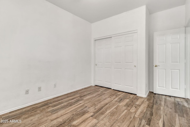 3044 E Sparrow Pl, Chandler, AZ 85286 - unfurnished bedroom featuring baseboards, a closet, and wood finished floors