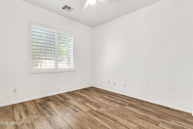 3044 E Sparrow Pl, Chandler, AZ 85286 - unfurnished room featuring baseboards, ceiling fan, visible vents, and wood finished floors