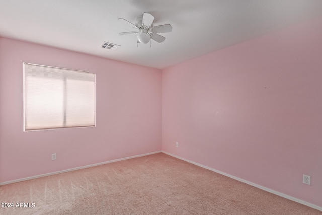 unfurnished room with carpet floors and ceiling fan