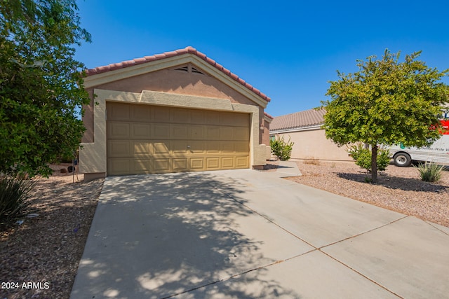 exterior space with an outbuilding and a garage