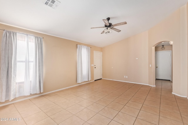 empty room with light tile patterned floors and ceiling fan