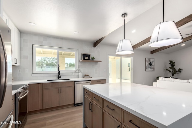 1736 N Ashbrook Cir, Mesa, AZ 85213 - kitchen featuring stainless steel appliances, a sink, light wood-type flooring, backsplash, and light stone counters