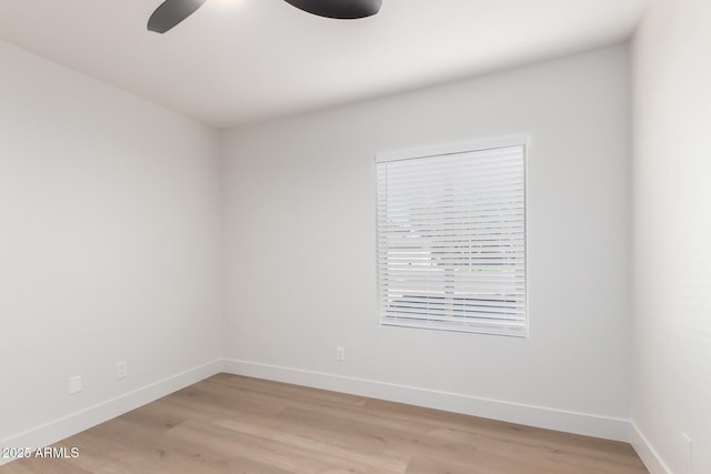 1736 N Ashbrook Cir, Mesa, AZ 85213 - unfurnished room featuring baseboards, light wood-style floors, and a ceiling fan