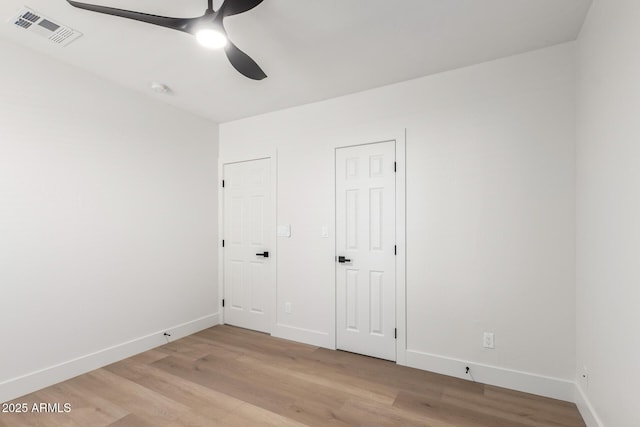 1736 N Ashbrook Cir, Mesa, AZ 85213 - unfurnished bedroom with light wood-style floors, baseboards, and a ceiling fan