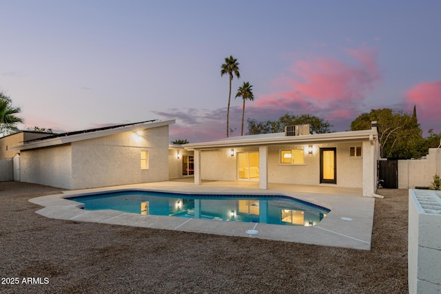 1736 N Ashbrook Cir, Mesa, AZ 85213 - back of property at dusk with a patio and stucco siding