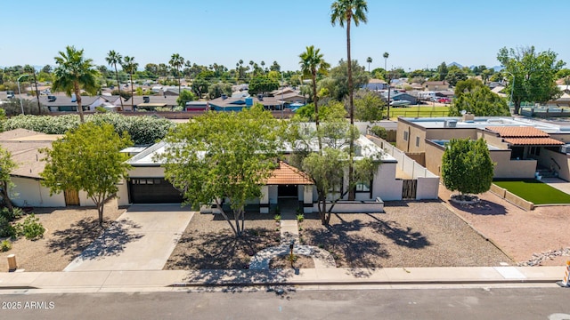 1736 N Ashbrook Cir, Mesa, AZ 85213 - view of front facade with a residential view, a garage, driveway, and stucco siding