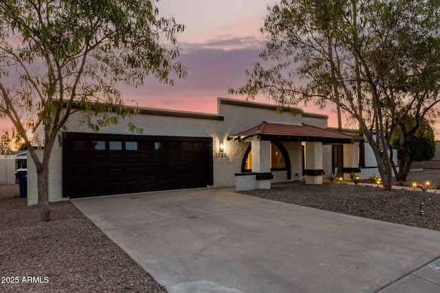 1736 N Ashbrook Cir, Mesa, AZ 85213 - view of front facade with a garage, driveway, and stucco siding