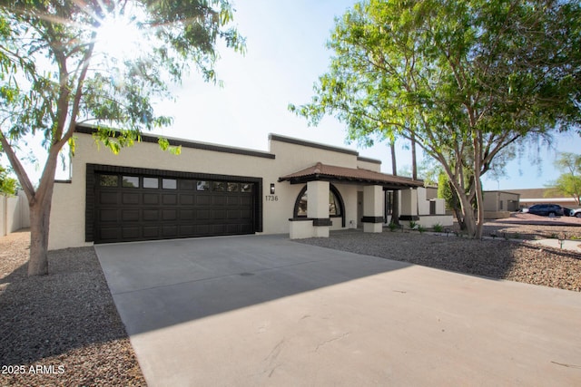 1736 N Ashbrook Cir, Mesa, AZ 85213 - mediterranean / spanish-style home featuring stucco siding, driveway, and a garage