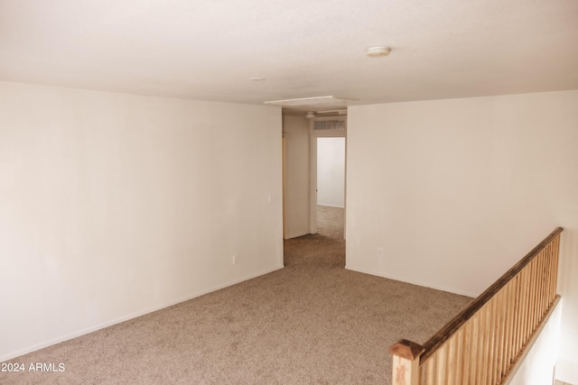 empty room featuring light carpet and visible vents