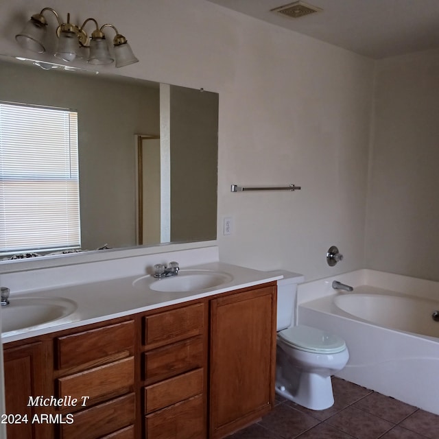 bathroom featuring vanity, toilet, a bathing tub, and tile patterned flooring