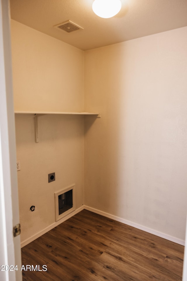 washroom featuring dark wood-type flooring and electric dryer hookup