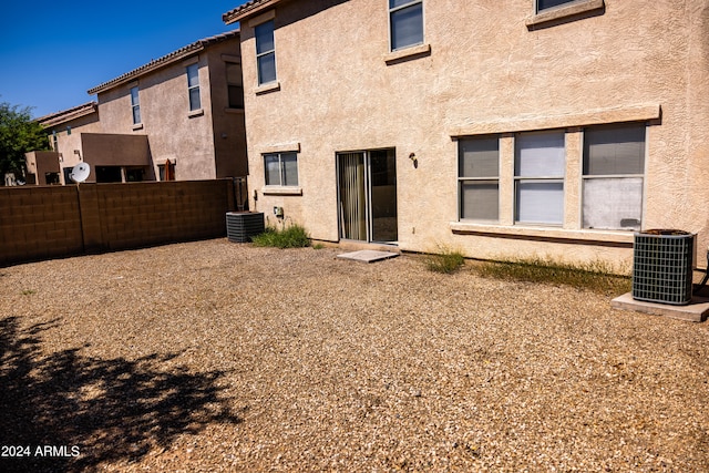 rear view of house with cooling unit