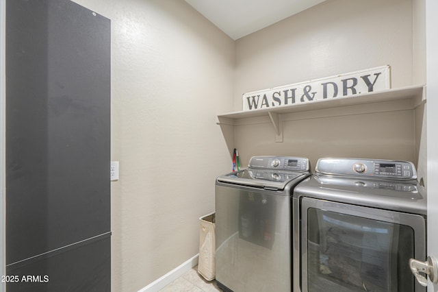 37903 W San Clemente St, Maricopa, AZ 85138 - washroom with washer and clothes dryer, baseboards, and tile patterned floors