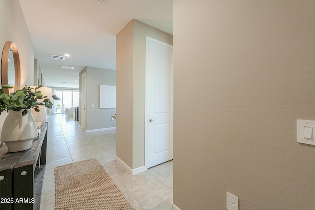 37903 W San Clemente St, Maricopa, AZ 85138 - hall featuring light tile patterned flooring, baseboards, and a textured wall