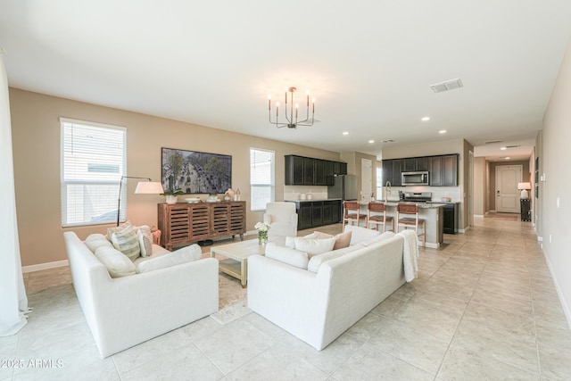 37903 W San Clemente St, Maricopa, AZ 85138 - living area with a chandelier, baseboards, recessed lighting, and light tile patterned floors