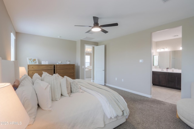37903 W San Clemente St, Maricopa, AZ 85138 - bedroom featuring ensuite bathroom, light colored carpet, baseboards, and ceiling fan
