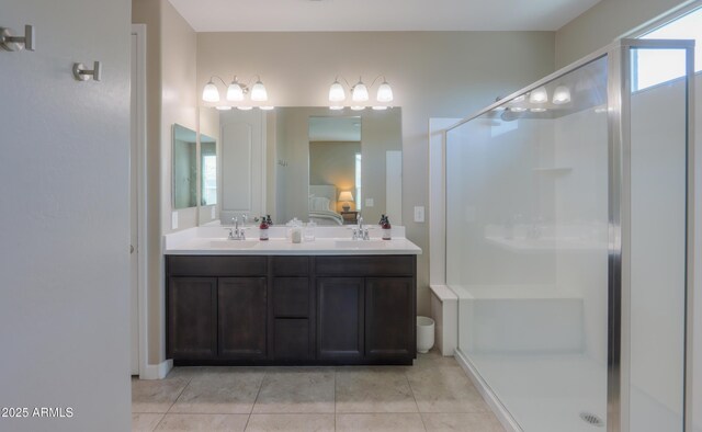 37903 W San Clemente St, Maricopa, AZ 85138 - bathroom featuring a shower stall, double vanity, tile patterned flooring, and connected bathroom
