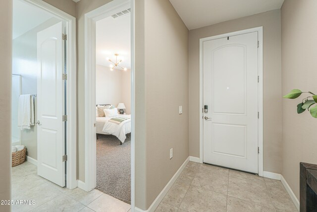 37903 W San Clemente St, Maricopa, AZ 85138 - corridor with baseboards and light tile patterned floors