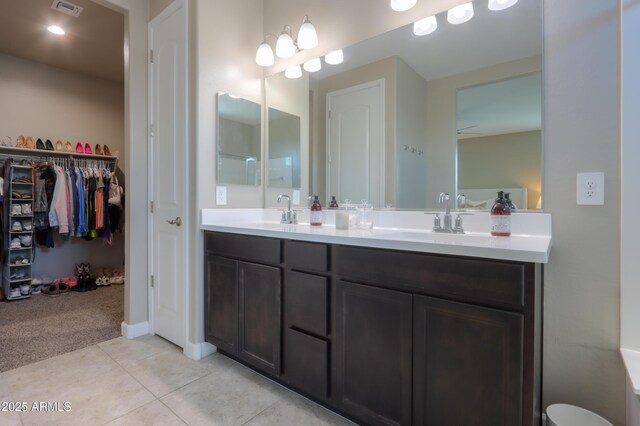 37903 W San Clemente St, Maricopa, AZ 85138 - full bath featuring double vanity, a spacious closet, and tile patterned flooring