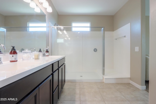 37903 W San Clemente St, Maricopa, AZ 85138 - full bathroom featuring healthy amount of natural light, a shower stall, double vanity, and tile patterned floors