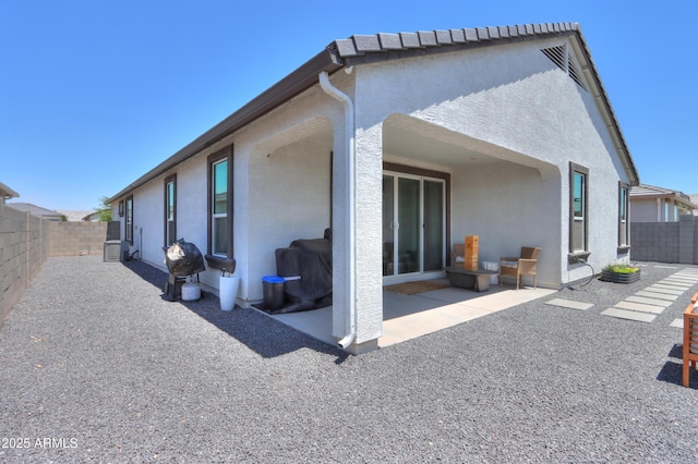 37903 W San Clemente St, Maricopa, AZ 85138 - back of house with stucco siding, a patio area, and a fenced backyard