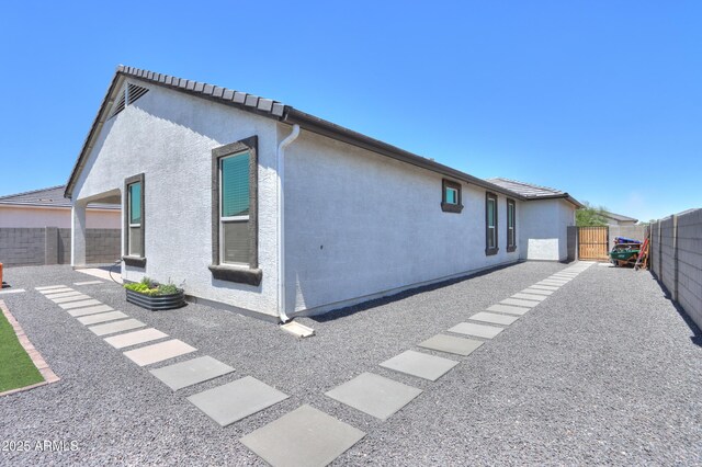 37903 W San Clemente St, Maricopa, AZ 85138 - rear view of house featuring a fenced backyard, a patio area, and stucco siding