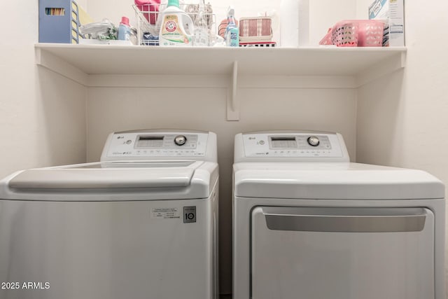 washroom featuring laundry area and separate washer and dryer